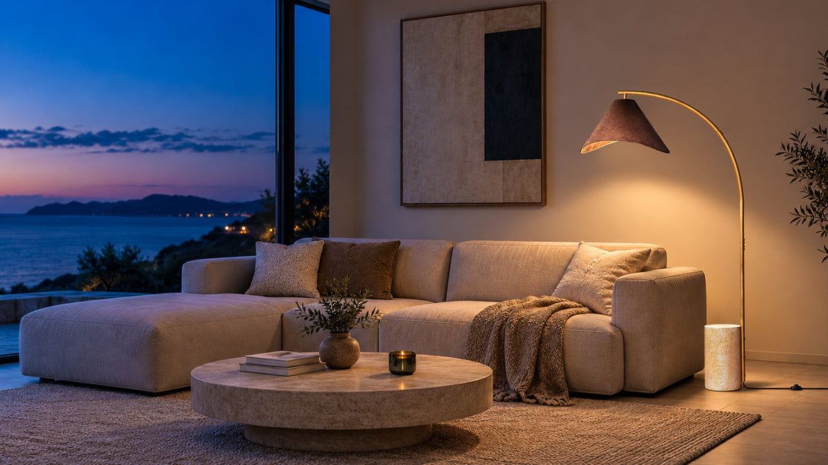Bentra floor lamp lighting a living room at dusk - desktop banner